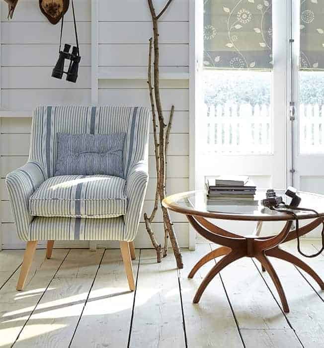 love this blue and white stripe linen covered armchair by vanessa arbuthnott. perfect for calm and contemporary coastal interiors
