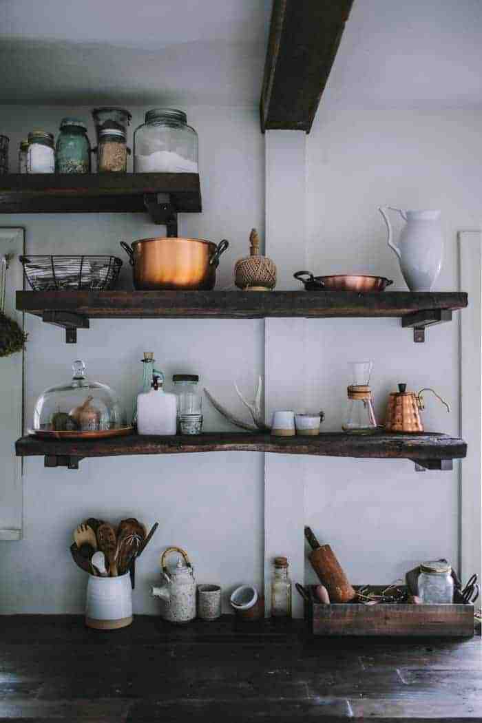 love this future kept modern rustic kitchen with open rustic wooden shelves, copper accessories and rustic ceramics. Click through for more modern rustic country interiors you'll love