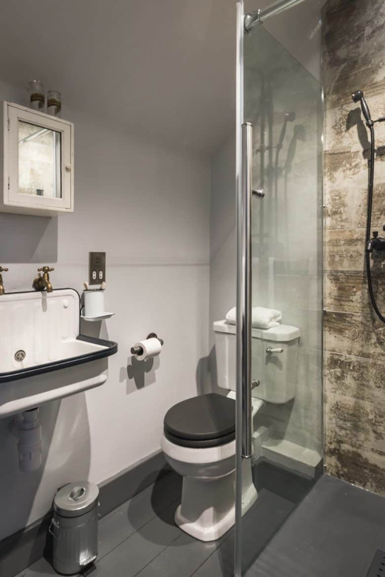 modern rustic bathroom shower decor interior idea combining vintage enamel sink, brass taps, reclaimed distressed wood shower splashback #rustic #bathroom #shower #reclaimed #vintage