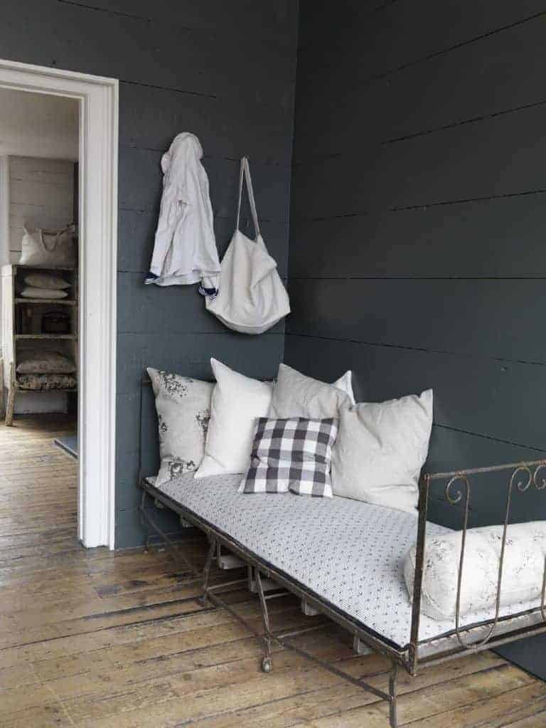 love this modern rustic daybed with dark grey wall and simple white and grey linens