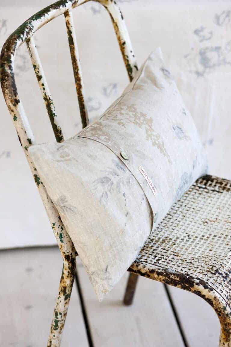 love this modern rustic rusted metal chair with linen cushion