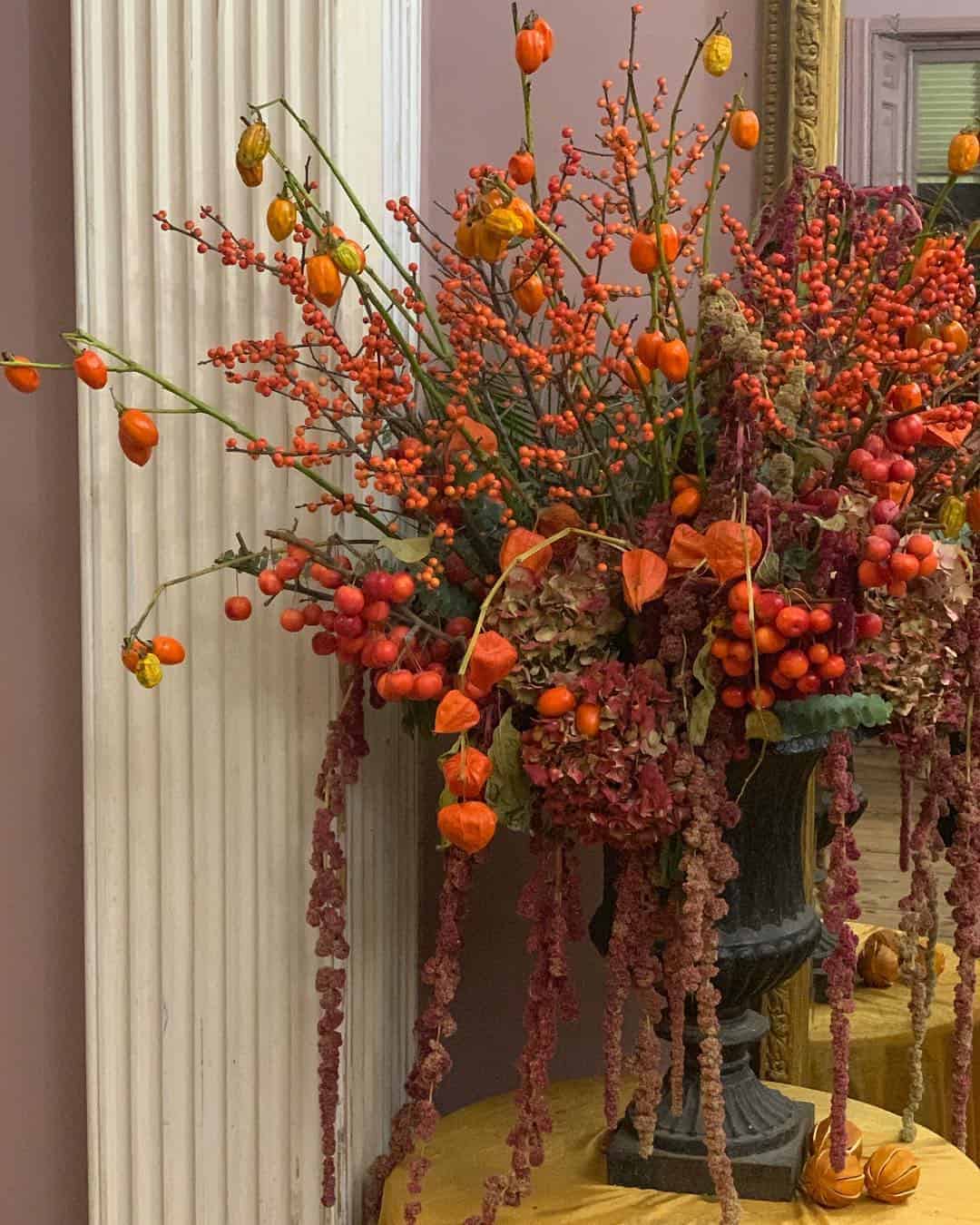 love these bright orange and red autumn flowers with chinese lantern and red berries by Kate Langdale click through for loads more creative autumn flower ideas you'll love