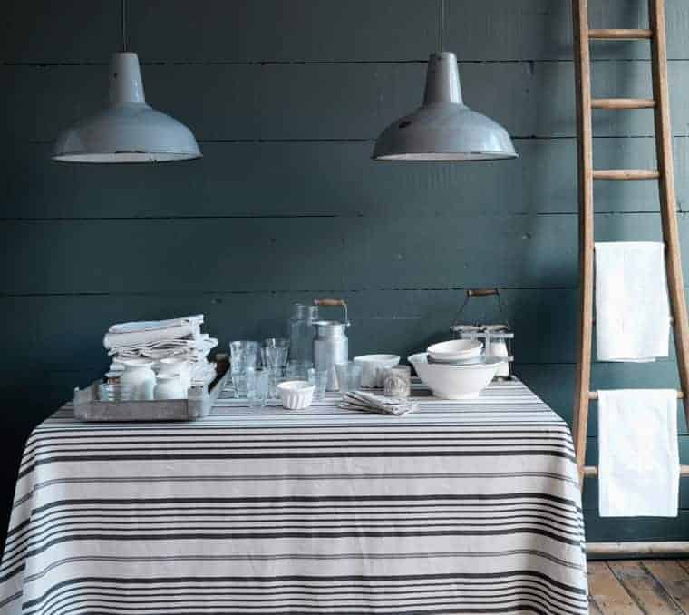 love this grey contemporary country kitchen look from Cabbages and Roses with stripe linens, simple wood and rustic glass and ceramics. Click through for more contemporary grey country kitchen ideas you'll love