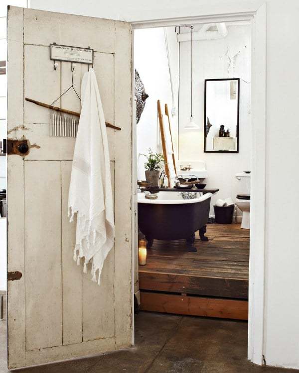 love this modern rustic bathroom with wood floor roll top bath and white walls