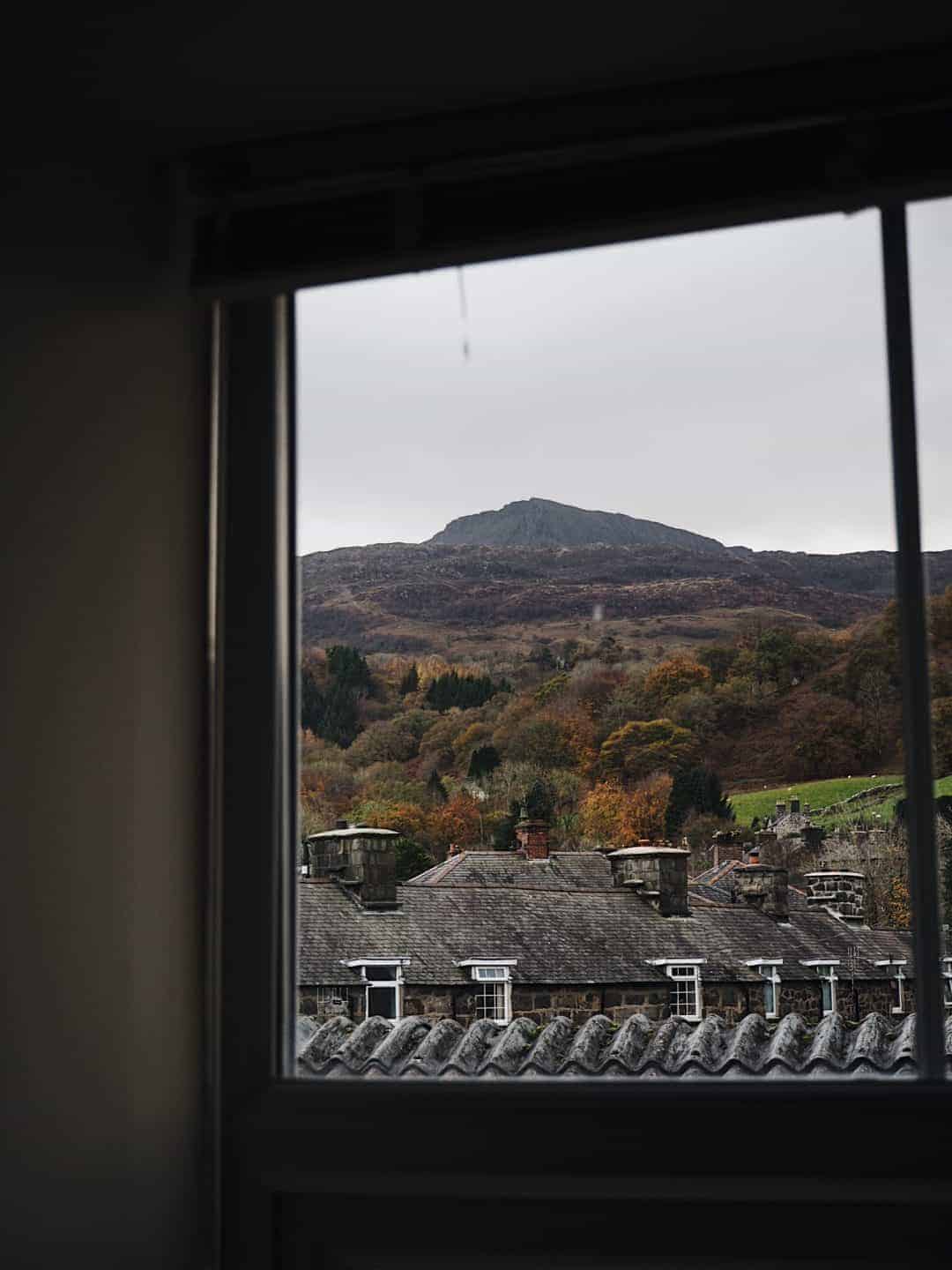 Love this moody window image with welsh mountain view. Slow living in Snowdonia - meet creative business coach, marketing mentor and blogger Simple and Season Kayte Ferris. She shares a little of the story behind her slow living lifestyle in Snowdonia as well as tips for achieving a more soulful lifestyle wherever you live