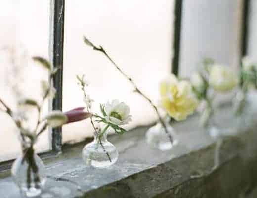 love these simple glass jars of flowers