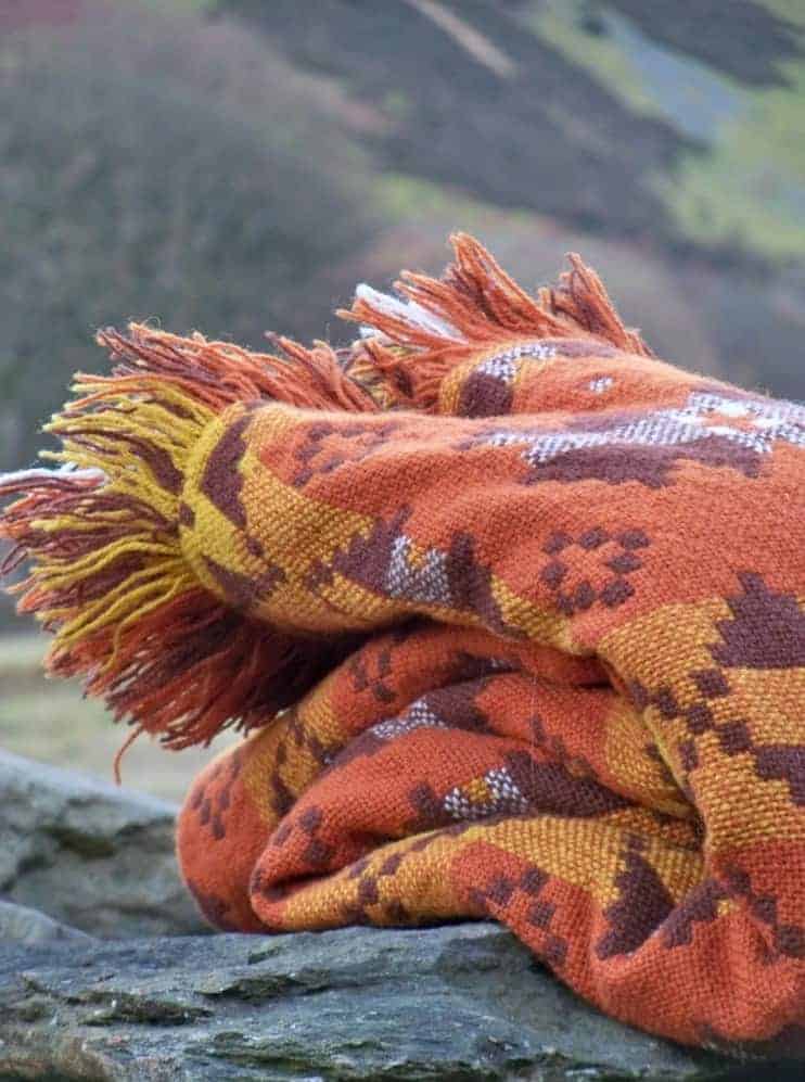 love this orange welsh blanket by jane beck. Click through for more welsh blanket ideas you'll love
