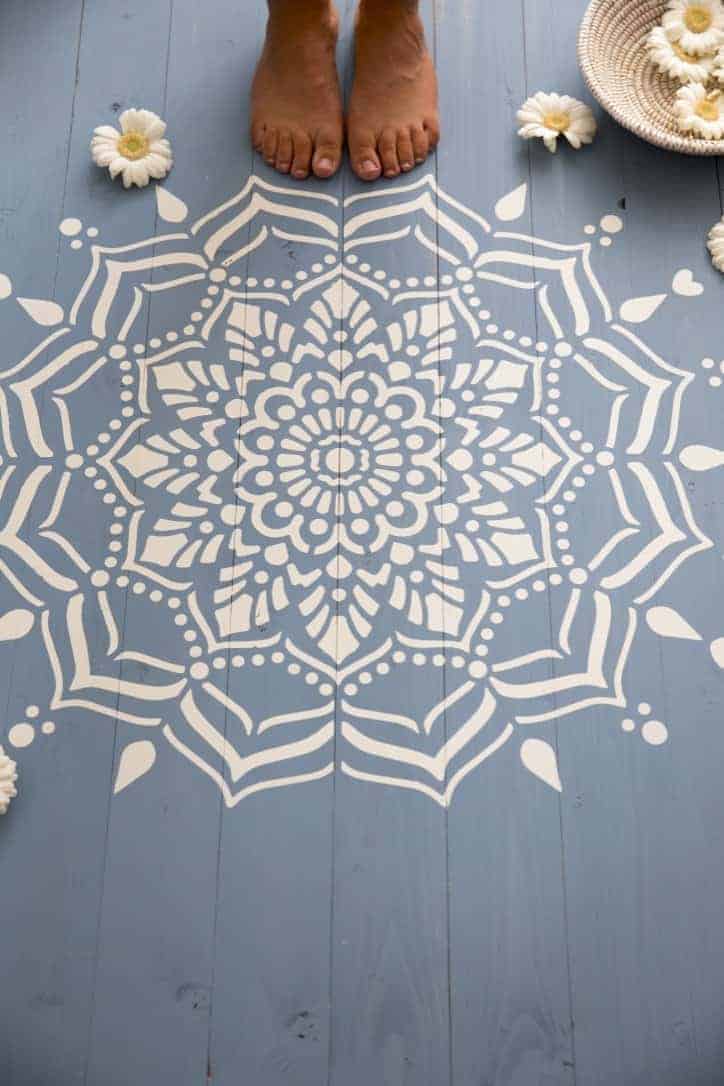 love this white painted mandala stencil pattern on blue painted floorboards. Click through for more ideas you'll love