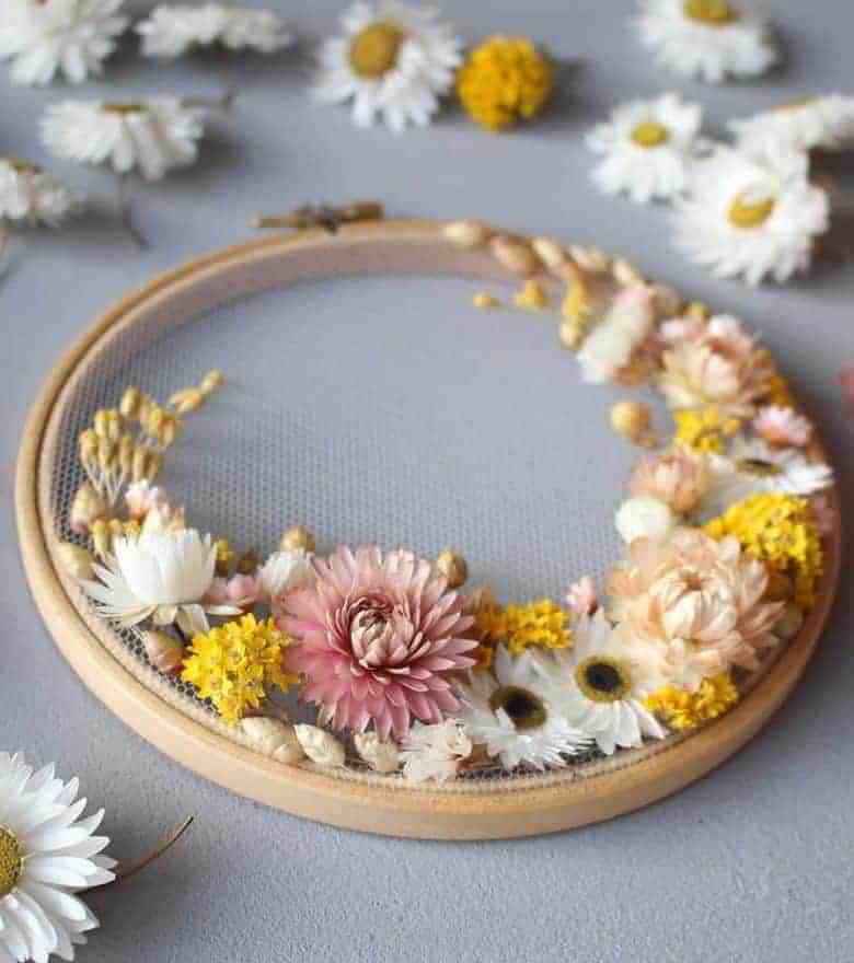 flower craft idea dried flower embroidery hoop art by olga prinku with step by step DIY tutorial and links to video tutorial #flowercrafts #frombritainwithlove #driedflower #embroidery #DIY #tutorial #hoopart