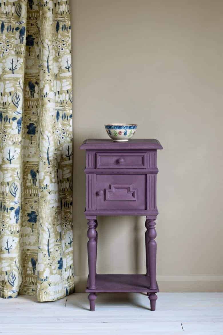 love this painted vintage side table in deep purple Rodmell by annie sloan with Charleston Farnhouse inspired chalk paint inspired by the bloomsbury group home of vanessa bell and duncan grant. Click through to find out more about this new paint collection as well as for tips and ideas from annie sloan herself on how to use the paints in your own home #anniesloan #chalkpaint #bloomsbury #decorating #ideas #purple #paint #frombritainwithlove #paintcolours #green #paintedfurniture #sidetable