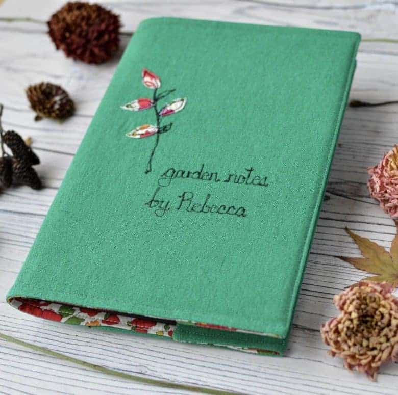 handmade personalised embroidered garden notebook by handmade at poshyarns. handmade christmas gift ideas for women made in Britain. Click through to discover other special ideas linen aprons, hand knits, personalised notebooks, baubles, hand-crafted jewellery, ethical natural beauty and more #handmadegifts #giftsforwomen #frombritainwithlove #madeinbritain #christmas gifts