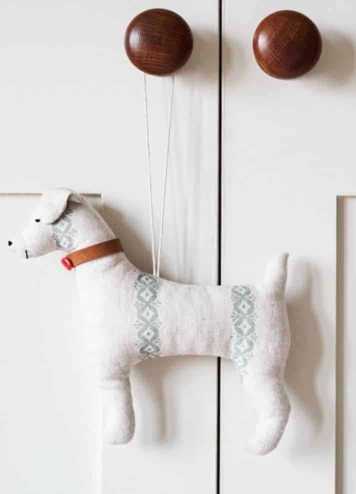 handmade linen dog decoration by Madder Cutch and Co using ethically printed linens. handmade christmas gift ideas for women made in Britain. Click through to discover other special ideas linen aprons, hand knits, personalised notebooks, baubles, hand-crafted jewellery, ethical natural beauty and more #handmadegifts #giftsforwomen #frombritainwithlove #madeinbritain #christmas gifts