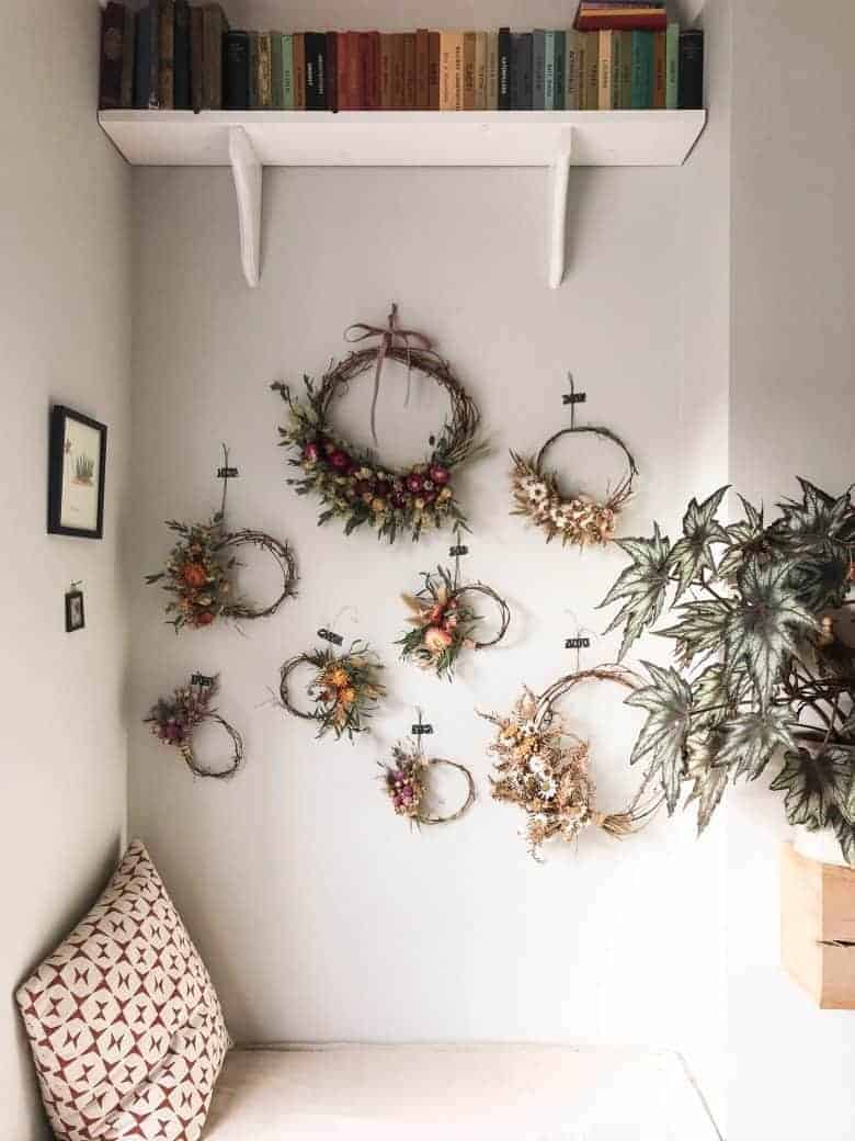 dried flower wreaths hanging on wall love these by bex of botanical tales. Click through to find out how to buy them ready made or make your own with Bex' book as well as lots of other creative ideas and step by step tutorial to make your own #dried #flowers #wreath #diytutorial