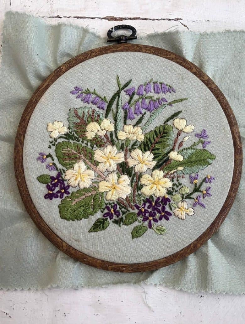 vintage embroidery bluebells primula violets on grey linen