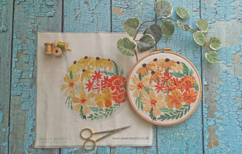 annie m embroidery kit nicotiana orange yellow and coral flowers in embroidery hoop