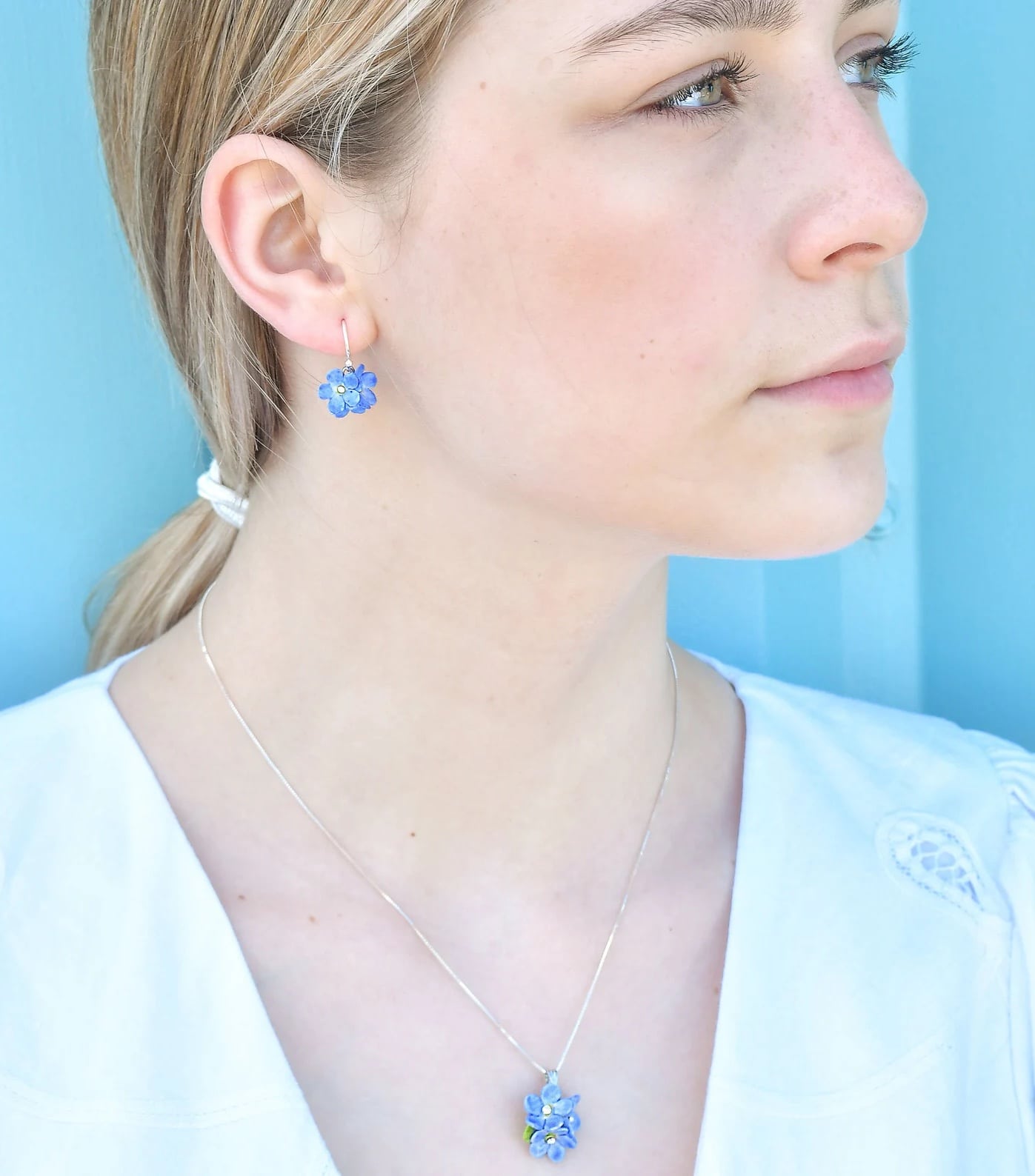 handmade silver and blue enamel forget me not earrings available to buy on Etsy and made in England
