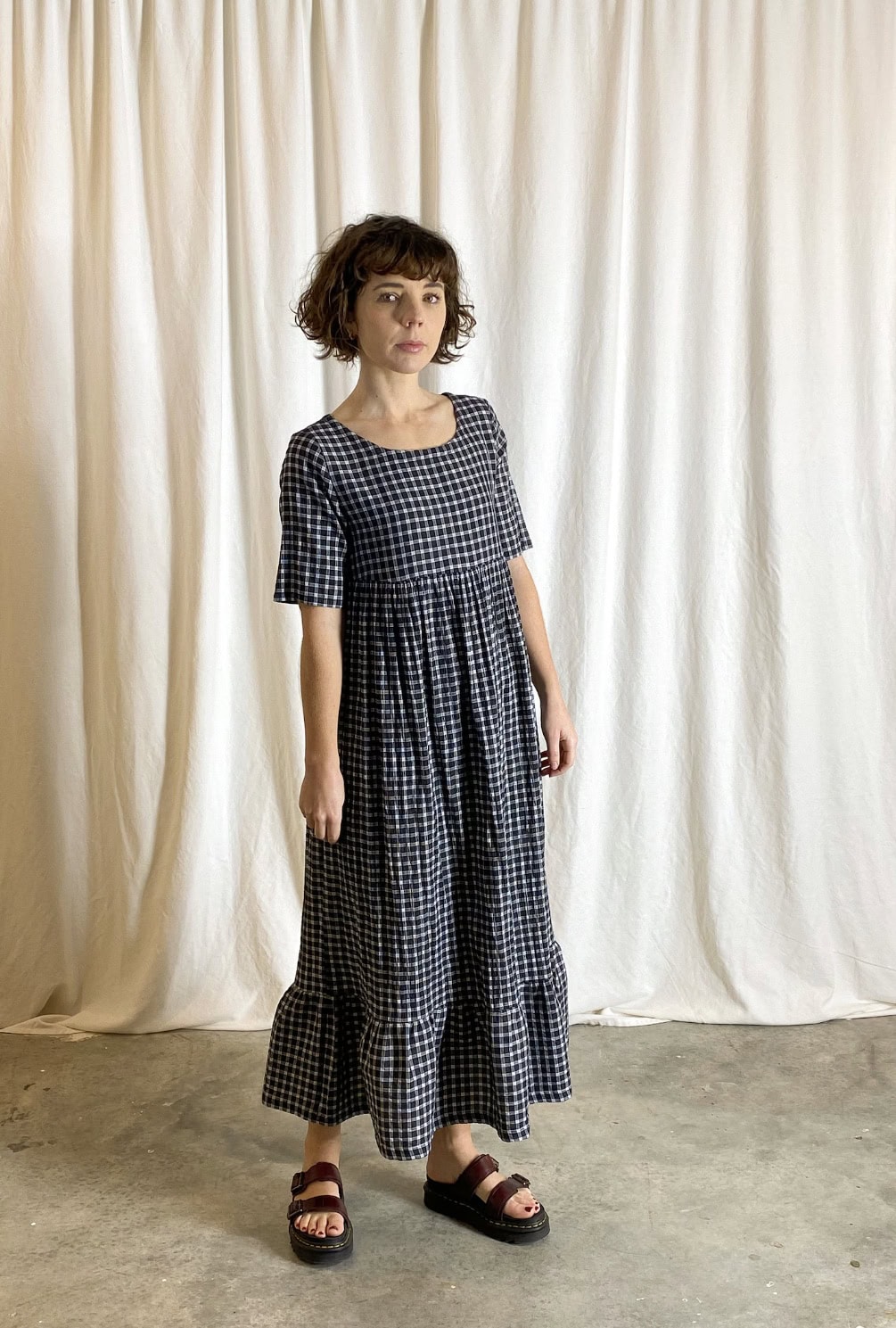 clare dress sewing pattern with round neck short sleeves and ruffled hem