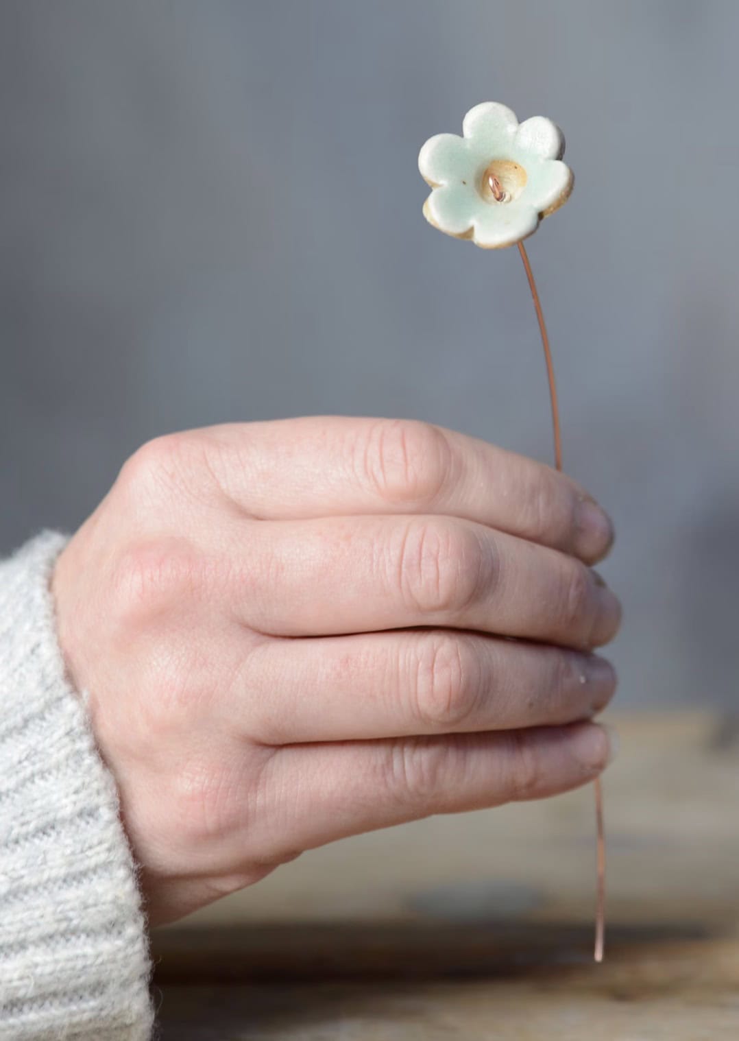 er wire Single handmade glazed ceramic flower on copper wire stem by sustainable British potter Habulous Ceramics